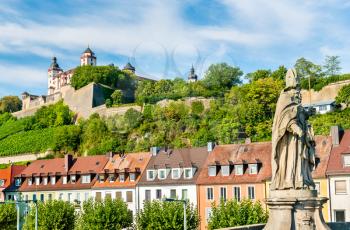 Statue on the Alte Mainbrucke and Marienberg Fortress in Wurzburg - Bavaria, Germany