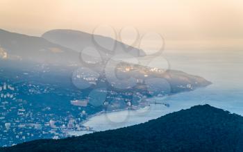 View of Yalta city from Ai-Petri mountain at sunset. Crimea
