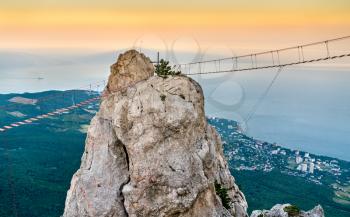 Rope bridges and a cross at Ai-Petri, a peak in the Crimean Mountains
