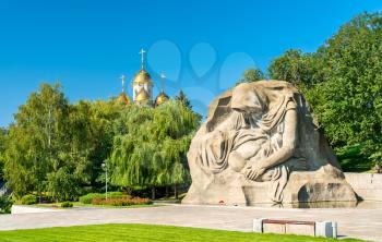 The Grieving Mother sculpture and a church on the Mamayev Kurgan in Volgograd, Russian Federation