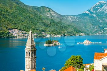 View of the Bay of Kotor with two small islands and a bell tower in Perast - Montenegro, Balkans