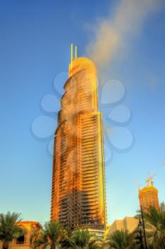 DUBAI, UAE - JANUARY 1: View of the Address Downtown Hotel on fire in Dubai on January 1, 2016. The tower caught fire on New Year's Eve