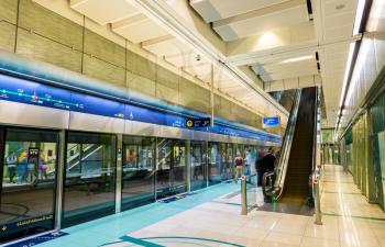 DUBAI, UAE - JANUARY 1: Interior of Baniyas Square metro station on January 1, 2016 in Dubai, UAE. The Dubai Metro is a driverless, fully automated metro rail network in United Arab Emirates