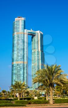 ABU DHABI, UAE - DECEMBER 29: Nation Towers. The towers have 52 and 65 floors, were built in 2013 and host the St. Regis hotel