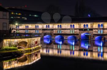 Night illumination of Barrage Vauban or Vauban weir in Strasbourg, France