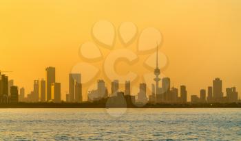 Skyline of Kuwait City at sunset. The capital of Kuwait, the Persian Gulf region