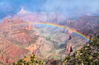 Rainbow above the Grand Canyon at the South Rim. Arizona, United States