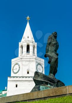 The statue of Musa Calil and the Spasskaya Tower of Kazan Kremlin in Russia