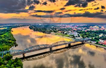 Jozef Pilsudski Bridge across the Vistula River at sunset in Torun, Poland