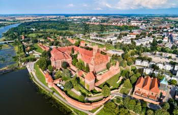 The Castle of the Teutonic Order in Malbork on the bank of the Nogat River. UNESCO world heritage in Poland