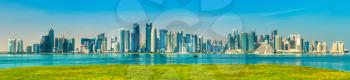 Panorama of Doha with green grass. The capital of Qatar.
