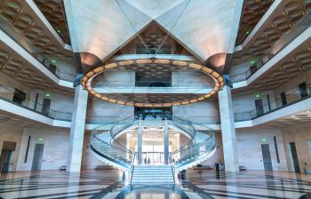Doha, Qatar: December 24, 2017: Interior of the Museum of Islamic Art. Built in 2008, it has a uniquely modern design influenced by ancient Islamic architecture