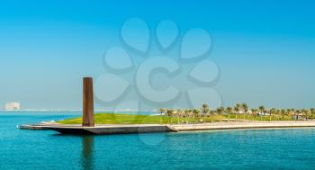 Doha, Qatar: December 24, 2017: Steel Obelisk in Museum of Islamic Art Park at Corniche waterfront