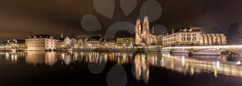 Zurich on banks of Limmat river at winter evening