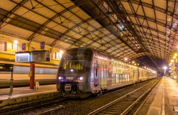 AVIGNON, FRANCE - JANUARY 02: Regional train TER 2N at Avignon station on January 2, 2014. SNCF operates 79 trains of this type