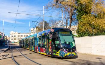MONTPELLIER, FRANCE - JANUARY 05: Alstom Citadis 402 tram on January 5, 2014 in Montpellier, France. The Montpellier tramway system has 4 lines and 84 stations