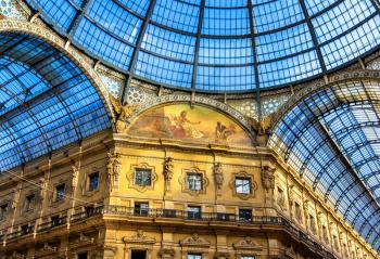 Milan, Italy - May 8, 2014: Interiors of Galleria Vittorio Emanuele II. Built in 1875 this gallery is one of the most popular shopping areas in Milan.