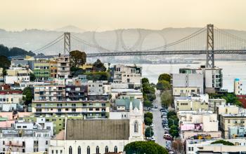 The San Francisco - Oakland Bay Bridge and the National Shrine of St. Francis of Assisi in San Francisco - California, United States
