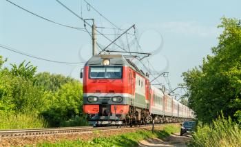 Electric locomotive with a passenger train in Russia, Ryazan region.