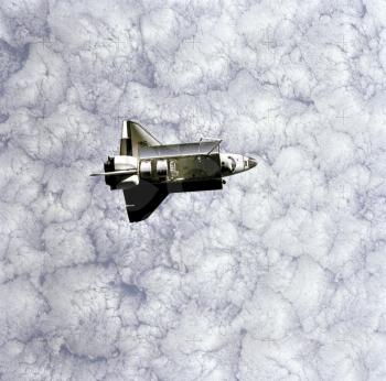 Royalty Free Photo of the Space Shuttle Challenger Flying over Earth 