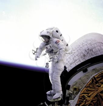 Royalty Free Photo of an Astronaut Standing on the Space Shuttle