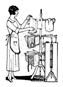 Royalty Free Clipart Image of a Woman Hanging Her Laundry on a Clothes Hanging Rack