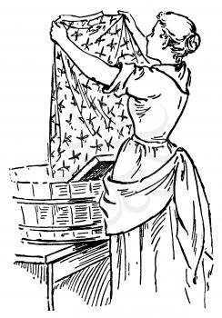 Royalty Free Clipart Image of a Woman Hanging Laundry 