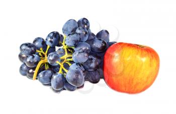 Bunch of black grapes and an apple on a light background