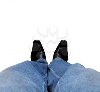 Feet of the man in jeans on a white background