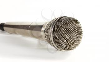 Microphone with a shadow on a light background
