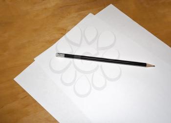 A sheet of white paper and a pencil on the table