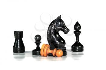 Several chess figures blurred with pawn on white background with reflection