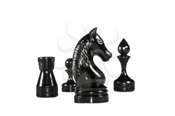 Several high contrast chess pieces isolated on white background