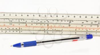 Ruler and pen on a white background