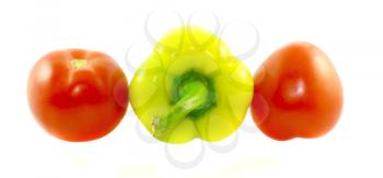 Sweet pepper and two tomatoes isolated on a white background