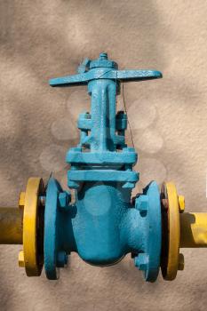 Old gas valve on the background wall