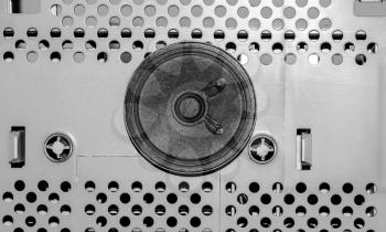 Part of the electrical device with a speaker on a metal plate