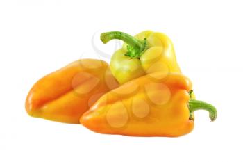 Three ripe sweet peppers isolated on a white background