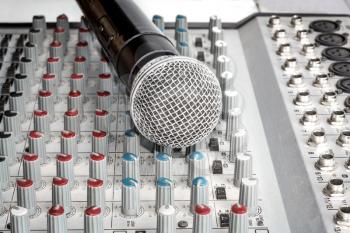 Mixing console and a wireless microphone closeup