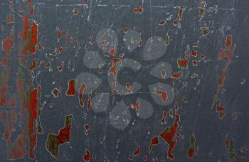 Abstract gray background with scratches and colored spots