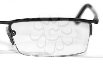 The left side of glasses on white background