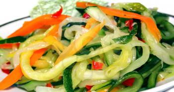 Vegetable salad close up on light background