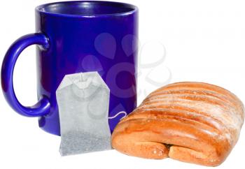 Cup, bun and tea bag isolated on white background