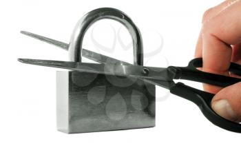 Isolated on white background hand with scissors cut closed padlock