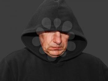 Stranger in the hood isolated on gray background