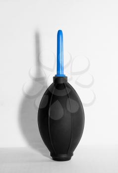 Rubber air cleaning pear with shadow on a light background