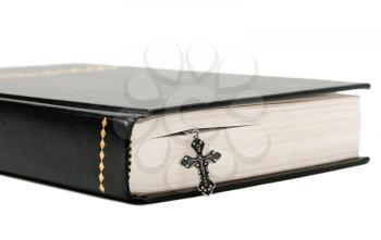 Bible and cross isolated on white background