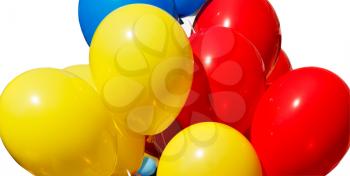 Yellow red and blue balloons isolated on a white background