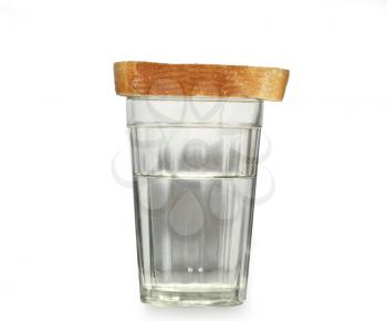 Glass of water and a piece of bread Isolated on white background