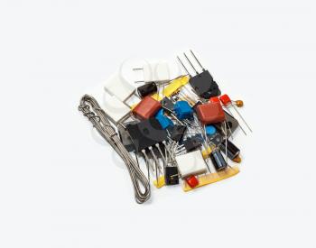 A handful of electronic components isolated on white background
